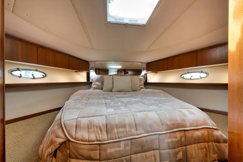 Slide: The Image of Luxurious cabin interior of 2004 Tiara Yachts 38 Open, featuring a cozy bed. - 42