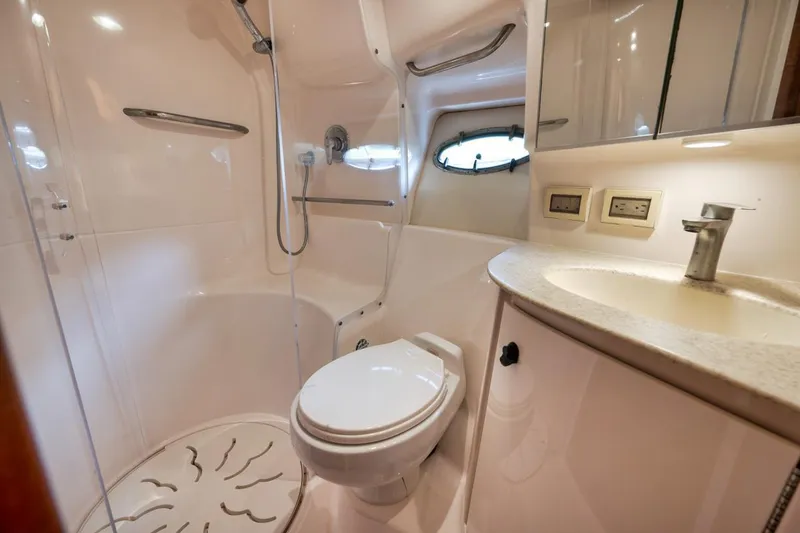 Slide: The Image of Luxurious bathroom in 2004 Tiara Yachts 38 Open, featuring modern fixtures and shower. - 44