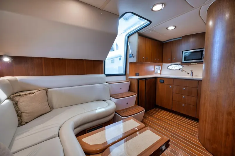 Slide: The Image of Luxurious interior of 2004 Tiara Yachts 38 Open, featuring elegant wood cabinetry and plush seating. - 45