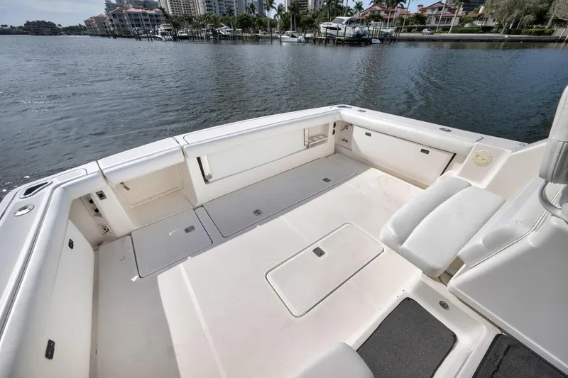 Slide: The Image of 2004 Tiara Yachts 38 Open boat deck with spacious seating and storage. - 49