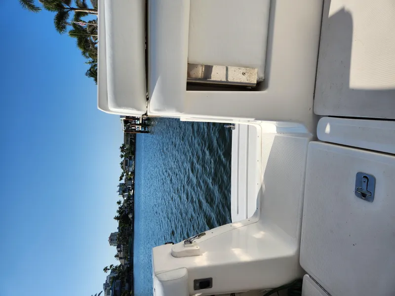 Slide: The Image of 2004 Tiara Yachts 38 Open, view from deck overlooking water and palm trees. - 8