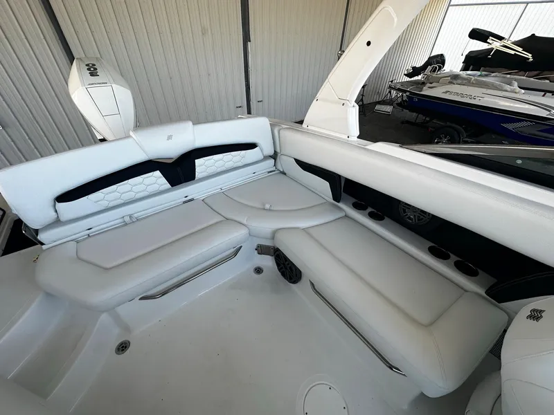 Slide: The Image of 2023 Four Winns HD8 OB boat interior with white leather seating. - 21