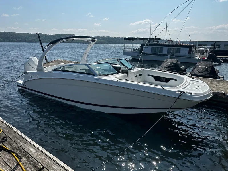 Slide: The Image of 2023 Four Winns HD8 OB boat docked on a sunny day. - 23