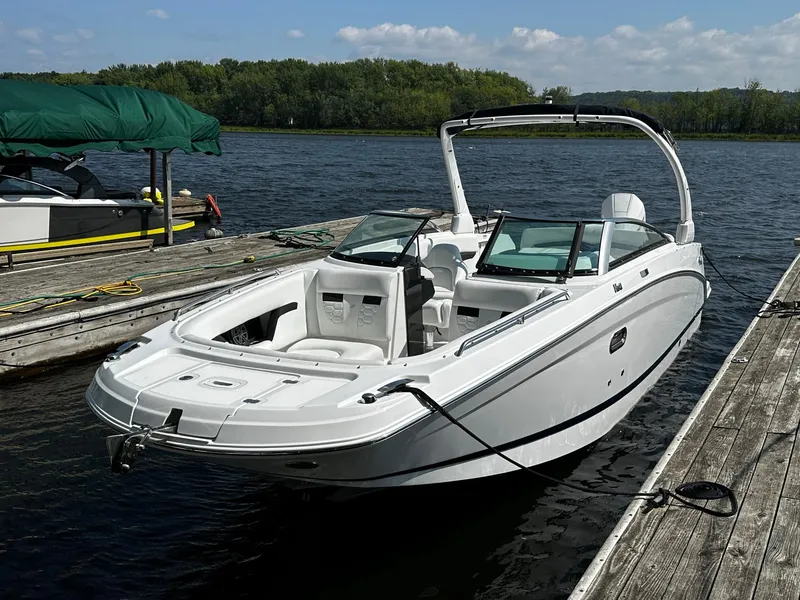 Slide: The Image of 2023 Four Winns HD8 OB boat docked on a sunny day. - 25