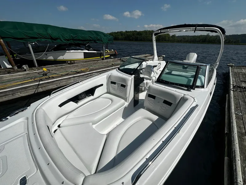 Slide: The Image of 2023 Four Winns HD8 OB boat docked on a sunny day. - 26