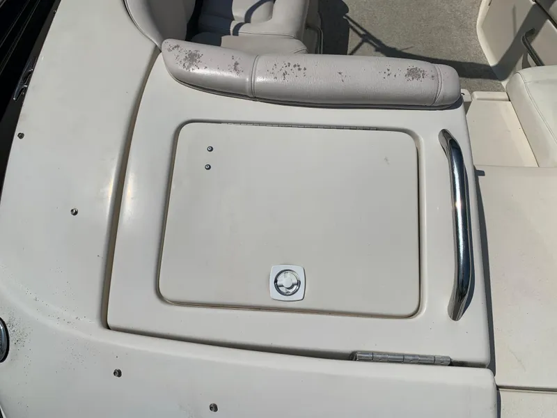 Slide: The Image of 2004 Crownline 270 BR boat seating and storage compartment. - 13