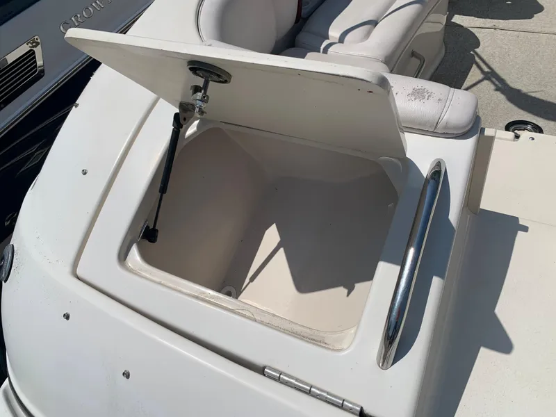 Slide: The Image of Open storage compartment on a 2004 Crownline 270 BR boat. - 14