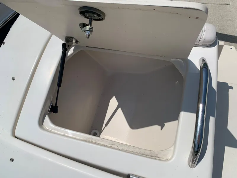Slide: The Image of Open storage compartment on a 2004 Crownline 270 BR boat. - 15