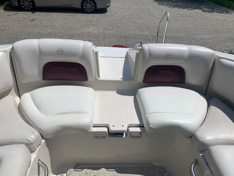 Slide: The Image of 2004 Crownline 270 BR boat interior seating area. - 21