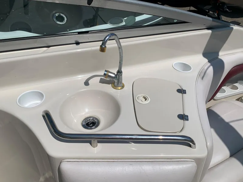 Slide: The Image of 2004 Crownline 270 BR boat sink and countertop area. - 29