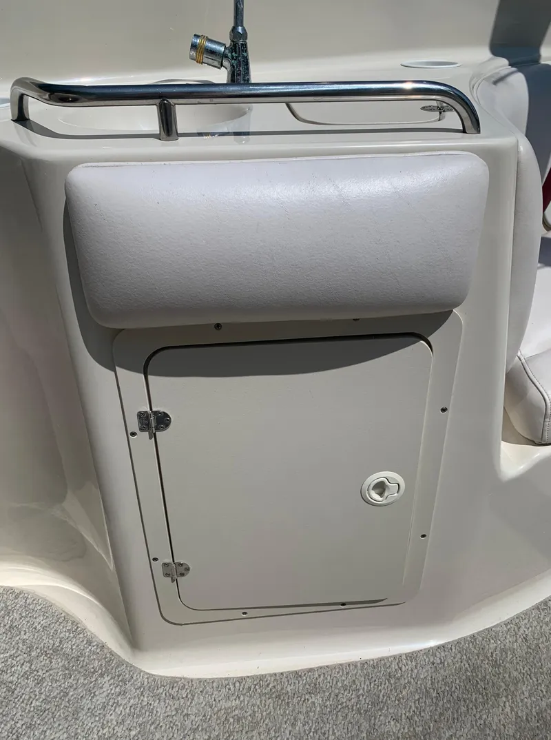 Slide: The Image of 2004 Crownline 270 BR boat sink and storage compartment. - 31