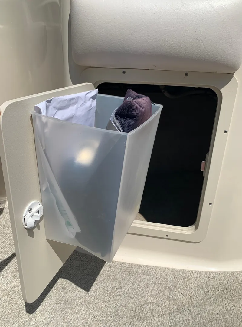 Slide: The Image of Storage compartment on a 2004 Crownline 270 BR boat. - 32