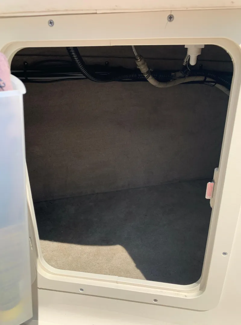 Slide: The Image of Storage compartment of a 2004 Crownline 270 BR boat. - 34