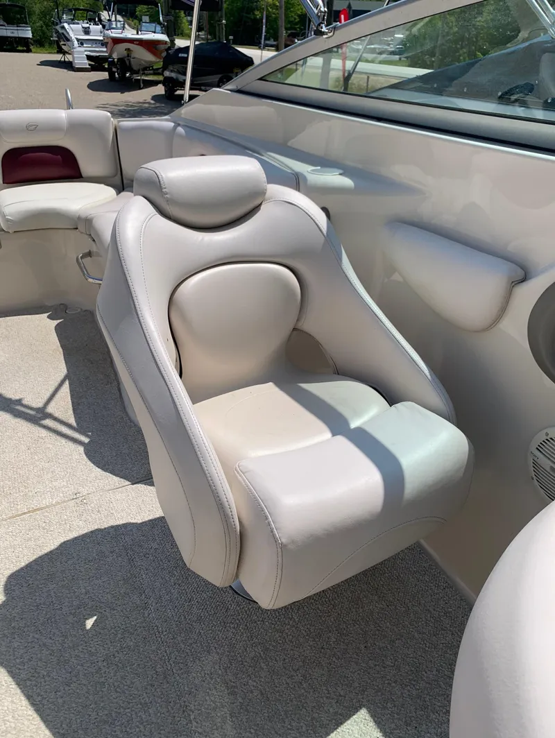 Slide: The Image of 2004 Crownline 270 BR boat interior with white leather seating. - 37