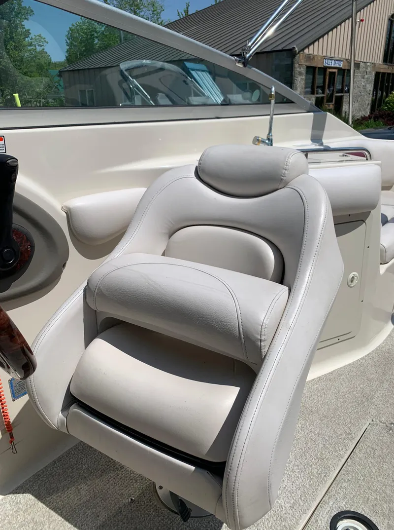 Slide: The Image of Captain's chair on a 2004 Crownline 270 BR boat. - 49