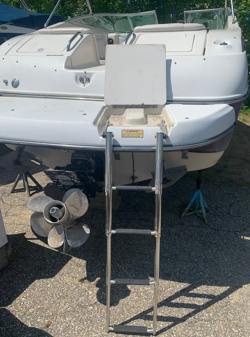 Slide: The Image of 2004 Crownline 270 BR boat with ladder and propeller. - 9