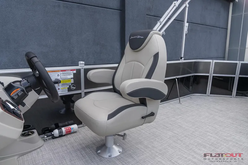 Slide: The Image of 2023 South Bay L-Lounge Tri-Toon 150HP captain's chair and helm station. - 13