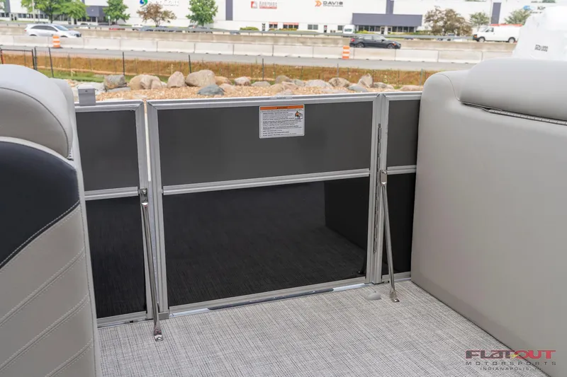 Slide: The Image of 2023 South Bay L-Lounge Tri-Toon 150HP interior gate view. - 16