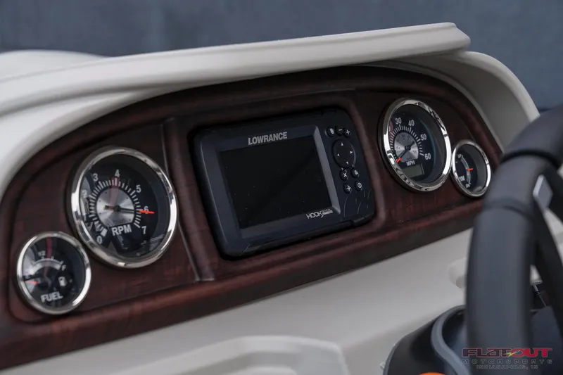 Slide: The Image of Dashboard of 2023 South Bay L-Lounge Tri-Toon 150HP with Lowrance display. - 17