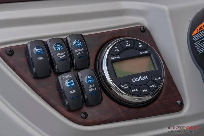 Slide: The Image of Control panel of 2023 South Bay L-Lounge Tri-Toon 150HP with Clarion audio system. - 18