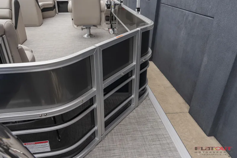 Slide: The Image of 2023 South Bay L-Lounge Tri-Toon 150HP interior, featuring luxurious seating and modern design. - 2