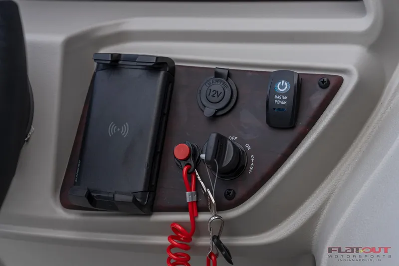 Slide: The Image of Control panel of 2023 South Bay L-Lounge Tri-Toon 150HP with power switch and phone holder. - 20