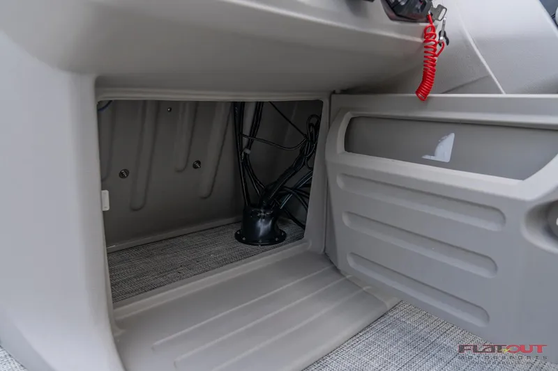 Slide: The Image of 2023 South Bay L-Lounge Tri-Toon 150HP storage compartment and wiring details. - 25