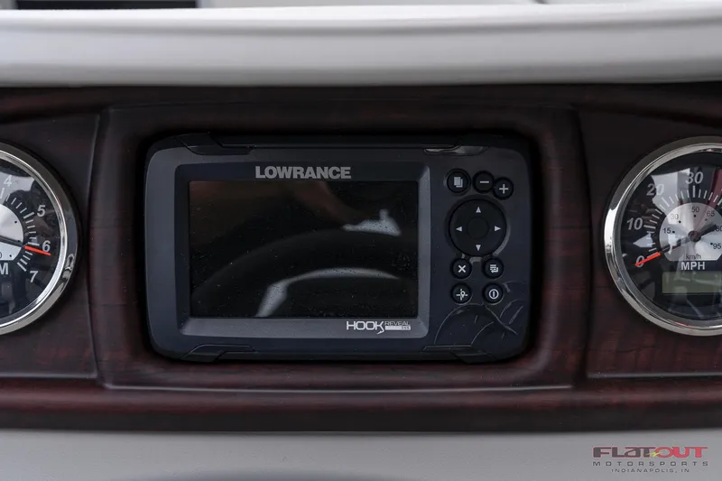 Slide: The Image of Lowrance Hook fish finder on 2023 South Bay L-Lounge Tri-Toon 150HP dashboard. - 26