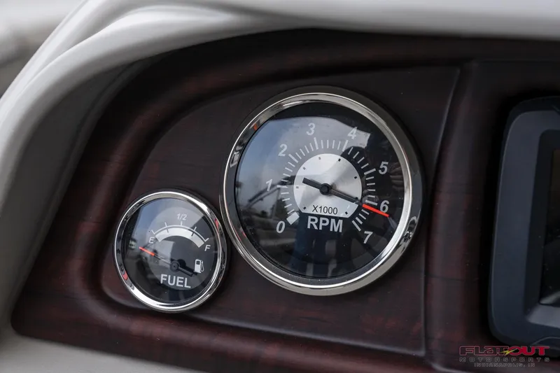 Slide: The Image of Close-up of 2023 South Bay L-Lounge Tri-Toon 150HP fuel and RPM gauges. - 27