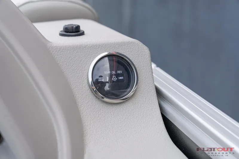 Slide: The Image of Close-up of the oil level gauge on a 2023 South Bay L-Lounge Tri-Toon 150HP boat. - 29