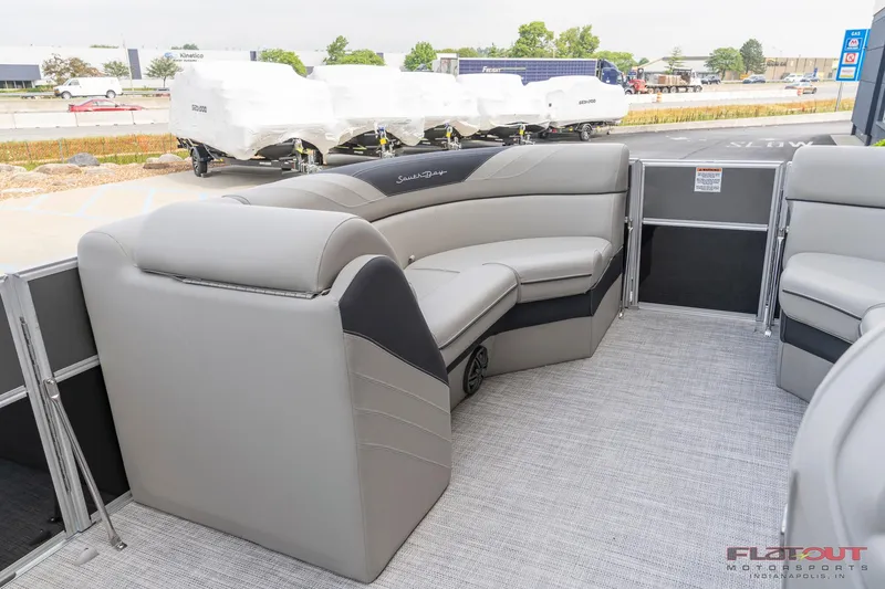 Slide: The Image of 2023 South Bay L-Lounge Tri-Toon 150HP interior with luxurious seating. - 34