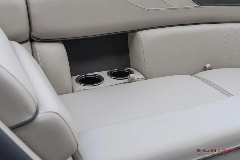 Slide: The Image of 2023 South Bay L-Lounge Tri-Toon 150HP boat interior with cup holders. - 37