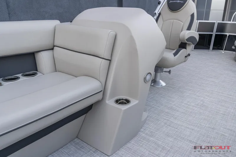 Slide: The Image of 2023 South Bay L-Lounge Tri-Toon 150HP boat interior with seating and cup holders. - 38
