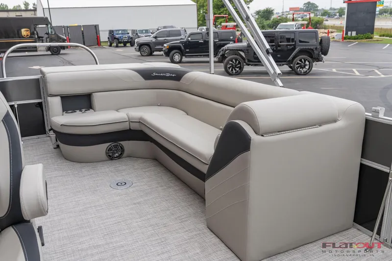 Slide: The Image of 2023 South Bay L-Lounge Tri-Toon 150HP interior with plush seating. - 4