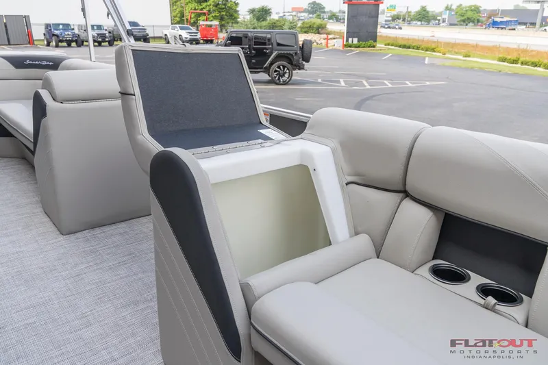 Slide: The Image of 2023 South Bay L-Lounge Tri-Toon 150HP boat interior with storage compartment open. - 40