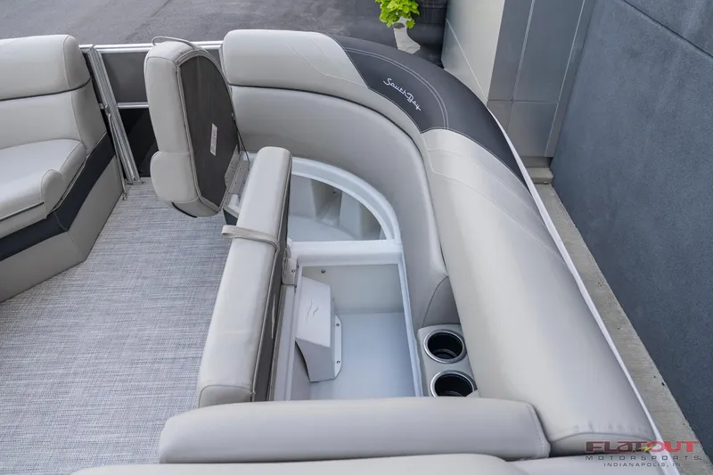 Slide: The Image of 2023 South Bay L-Lounge Tri-Toon 150HP interior seating and storage compartments. - 43