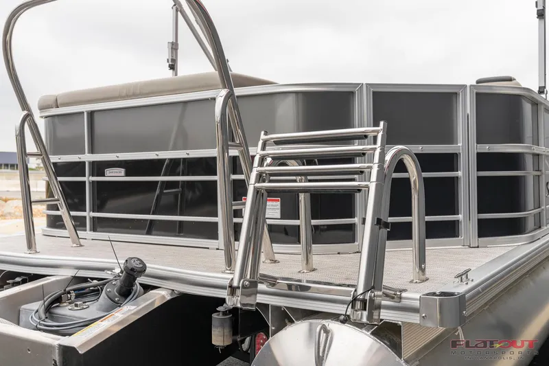 Slide: The Image of 2023 South Bay L-Lounge Tri-Toon 150HP rear view with ladder and railing. - 47