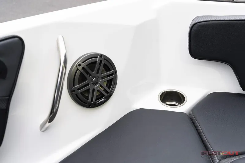 Slide: The Image of 2023 Scarab 215 ID boat interior with speaker, cup holder, and handrail. - 11