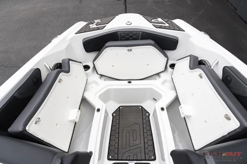 Slide: The Image of 2023 Scarab 215 ID boat interior with open storage compartments. - 13