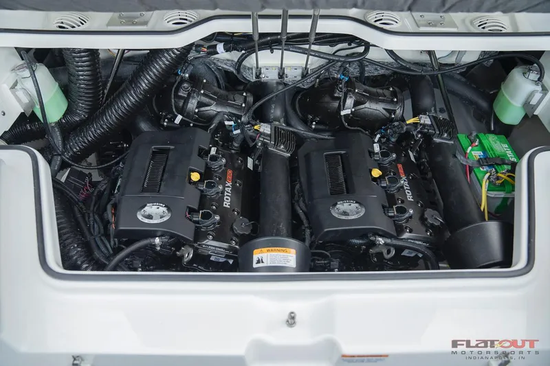Slide: The Image of 2023 Scarab 215 ID engine compartment with dual Rotax engines. - 17