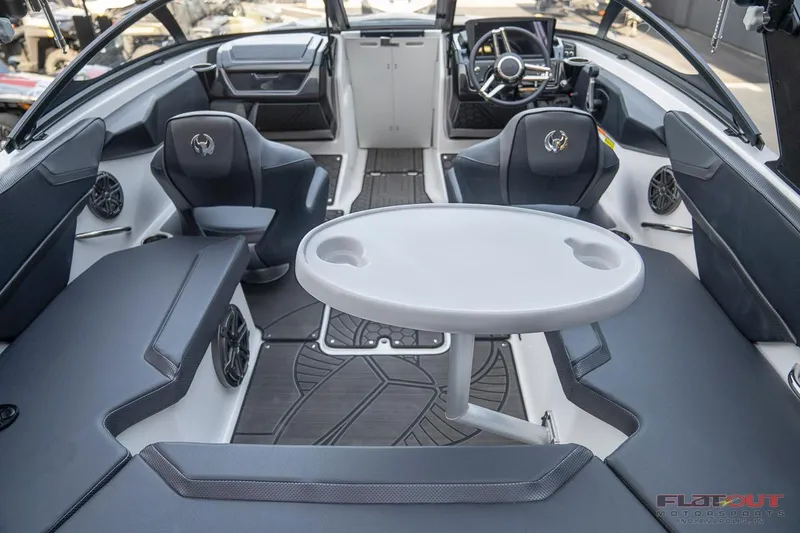 Slide: The Image of 2023 Scarab 215 ID boat interior with seating and table. - 19