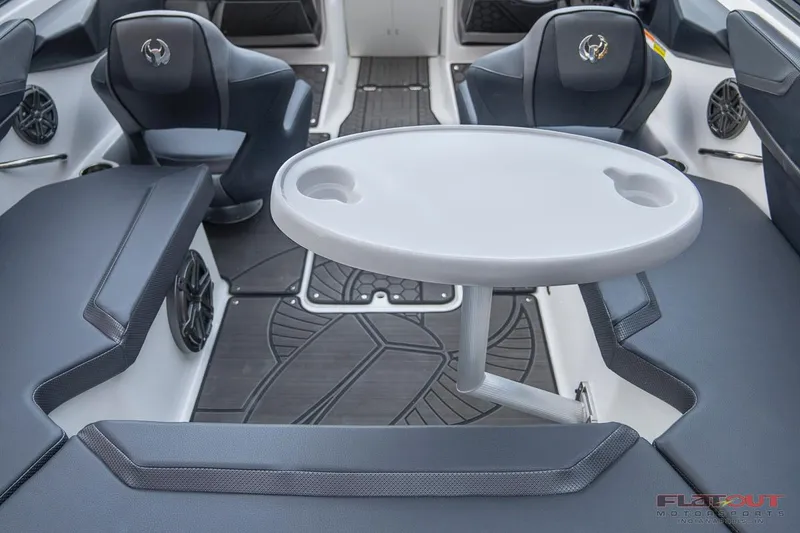 Slide: The Image of 2023 Scarab 215 ID boat interior with seating and table. - 20