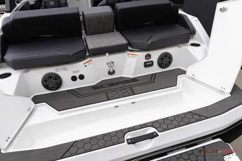 Slide: The Image of 2023 Scarab 215 ID boat interior with seating and speakers. - 24