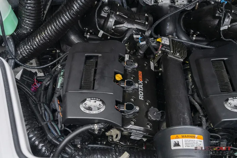 Slide: The Image of 2023 Scarab 215 ID engine compartment with Rotax 200 engines. - 25