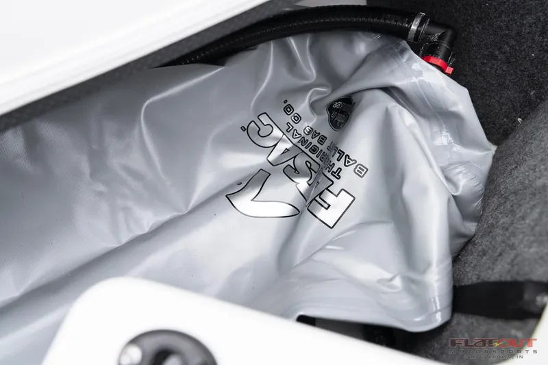 Slide: The Image of 2023 Scarab 215 ID boat ballast bag in storage compartment. - 28