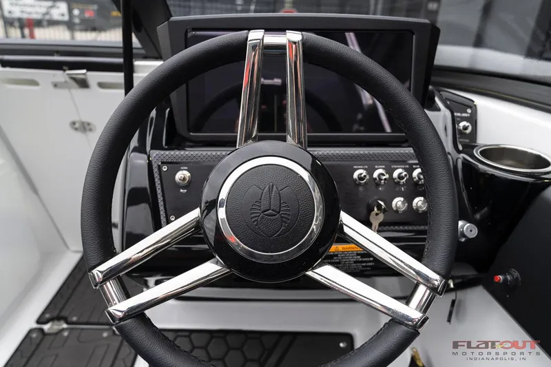 Slide: The Image of 2023 Scarab 215 ID boat steering wheel and dashboard. - 33
