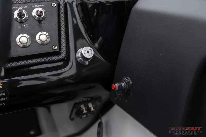 Slide: The Image of Close-up of 2023 Scarab 215 ID boat dashboard controls. - 35