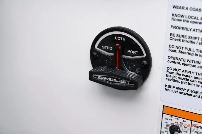 Slide: The Image of 2023 Scarab 215 ID boat control switch with safety instructions. - 36