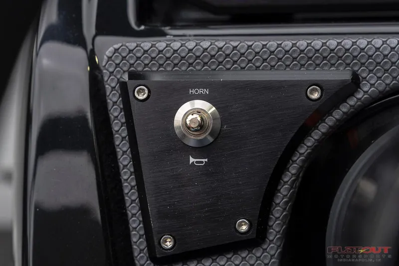 Slide: The Image of Close-up of 2023 Scarab 215 ID boat horn button. - 38