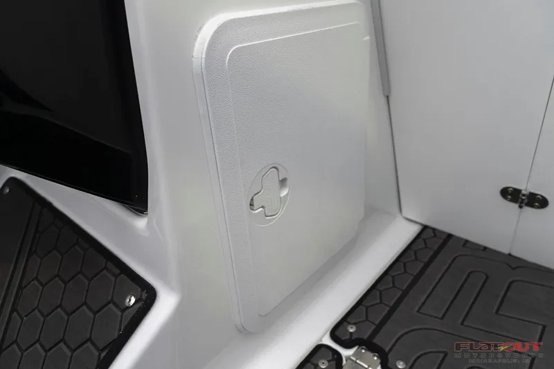 Slide: The Image of 2023 Scarab 215 ID boat interior storage compartment and flooring. - 39